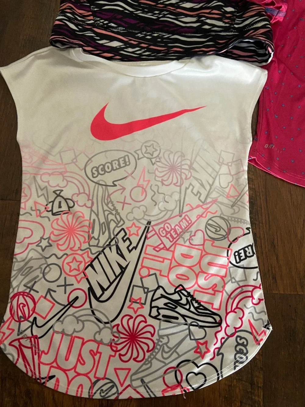 Two Nike t-shirts 5-7yo White pink